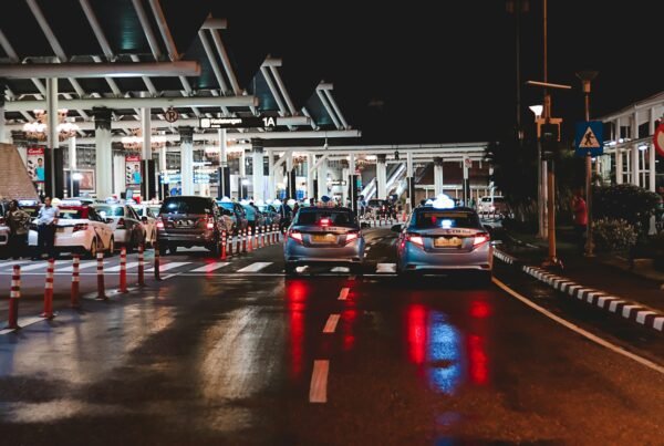 cars on road near station during night
