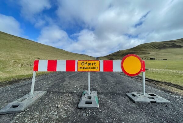a road closed off with a sign on it
